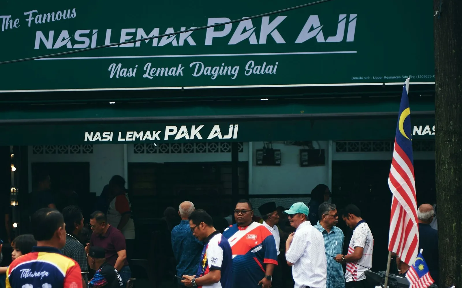 Nasi lemak stall in Kampung Baru, Kuala Lumpur, busy with local customers Nasi lemak stall in Kampung Baru, Kuala Lumpur, busy with local customers