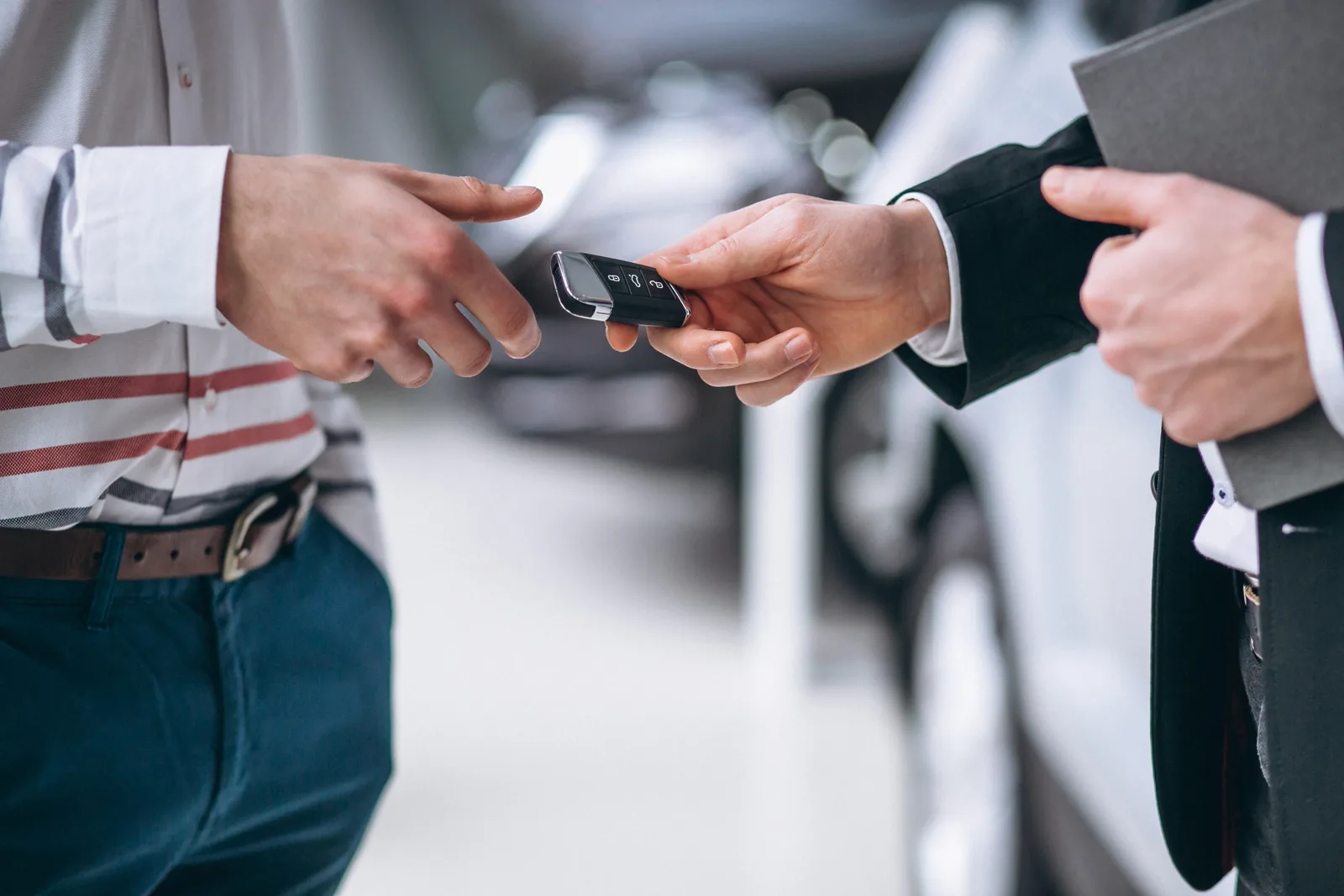 Car key handover for a Maha Empire Car Rental booking in Malaysia